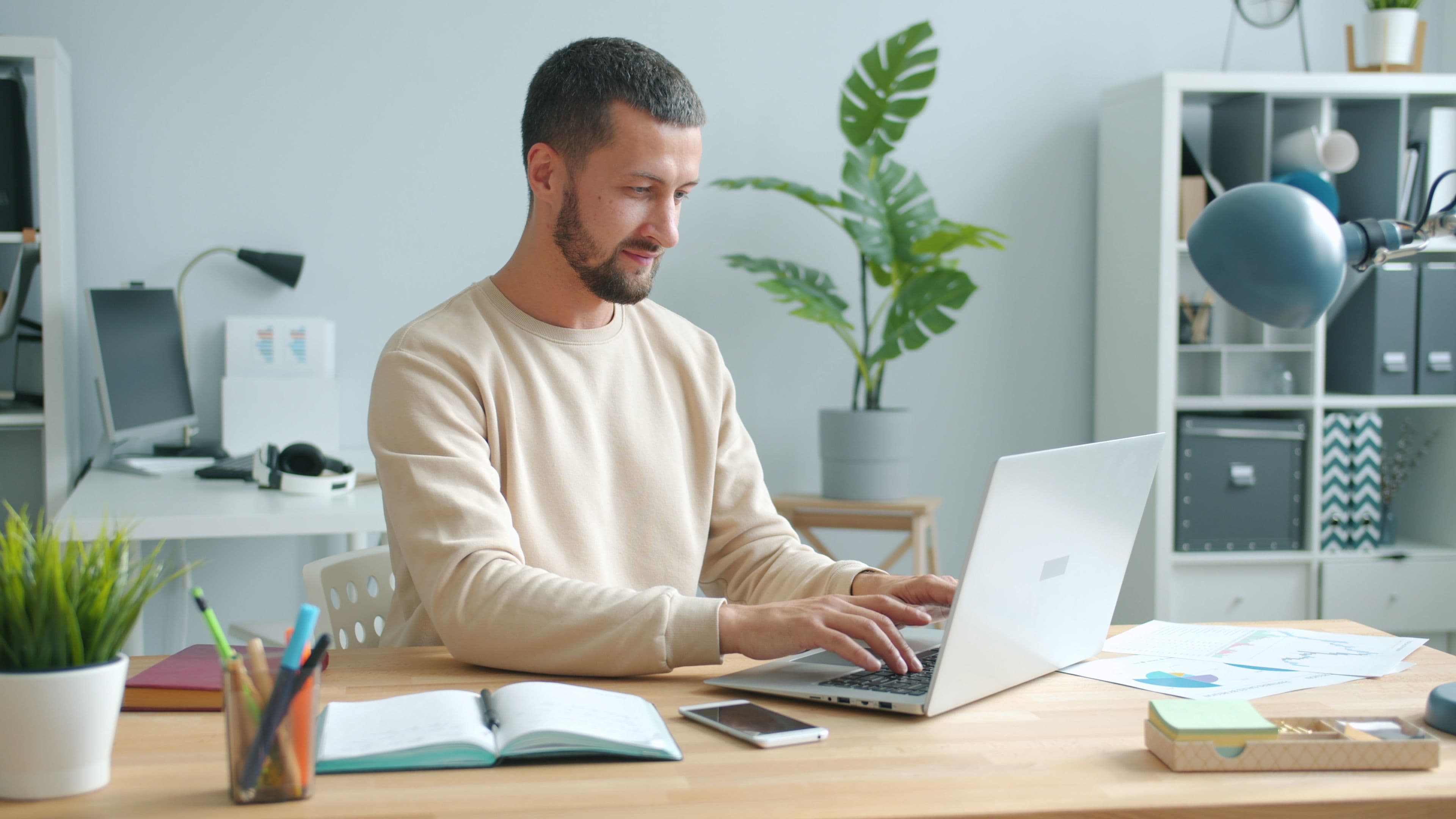Professional working happily in a clean modern office